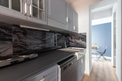 a kitchen with a sink and a counter top at Modern and Cozy 2BR in Vibrant Cihangir in Istanbul