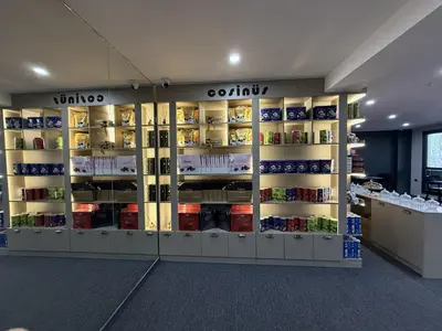 a store aisle with shelves of food and spices at Cosinüs Airport Hotel in Arnavutköy
