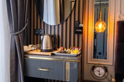 a table with a coffee maker and a mirror at The Wind Beşiktaş in Istanbul