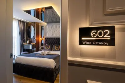 a room with a bed and a sign on the wall at The Wind Beşiktaş in Istanbul