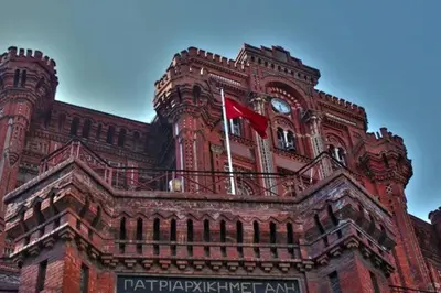 a building with a red flag on top of it at Private house with 4 separate apartments-for families & friend groups in Istanbul