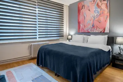 a bedroom with a large bed and a large window at Luxury with Exceptional Terrace and Bosphorus View in Istanbul