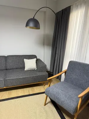a living room with a couch and a chair at Trio Houses in Istanbul