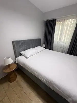 a bedroom with a large bed and a table at Trio Houses in Istanbul