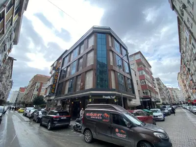 a van parked in front of a building on a city street at Zirvesta Otel in Istanbul