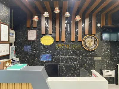 a store with a counter with a clock on a wall at Zirvesta Otel in Istanbul