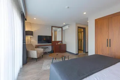 a bedroom with a bed and a desk and a table at Best Western Plus Sapanca in Sapanca