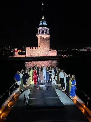 a group of people standing on a boat at night at Private Luxury Bosphorus Yacht 2 Continents Experience in Istanbul
