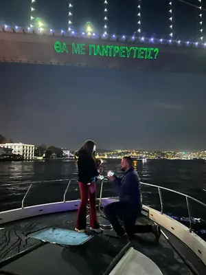 a man and a woman on a boat in the water at Private Luxury Bosphorus Yacht 2 Continents Experience in Istanbul