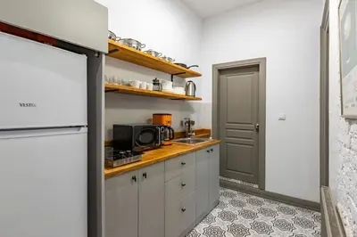 a kitchen with a sink and a microwave at Ganbaru Tours - Flats in Galata 2 in Istanbul