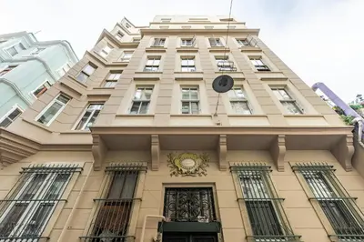 a tall building with a clock on top of it at Ganbaru Tours - Flats in Galata 2 in Istanbul