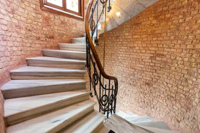 a staircase in a brick wall with a stair case at Hotel Pera Parma in Istanbul