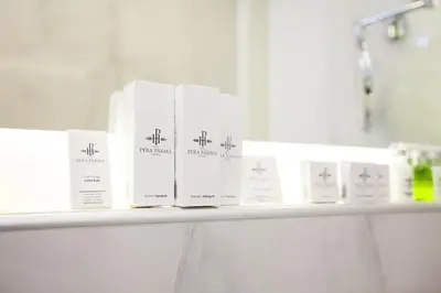 four books sitting on a shelf in a bathroom at Hotel Pera Parma in Istanbul