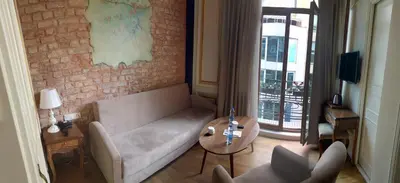 a living room with a couch and a table at Hotel Pera Parma in Istanbul