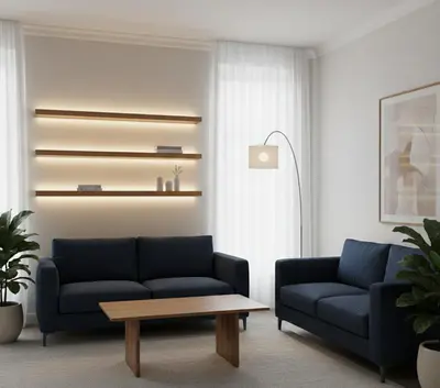 a living room with two blue couches and a table at Yeni Yıl Apart in Bandırma