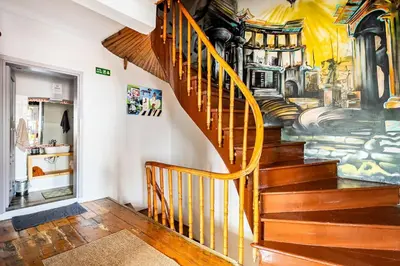 a staircase in a room with a mural on the wall at Timeless House Overlooking the Golden Horn with Sea - Nilorayn in Istanbul