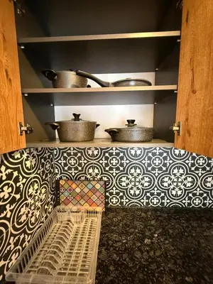 a kitchen with pots and pans on a wall at AYD Apartment Taksim in Istanbul