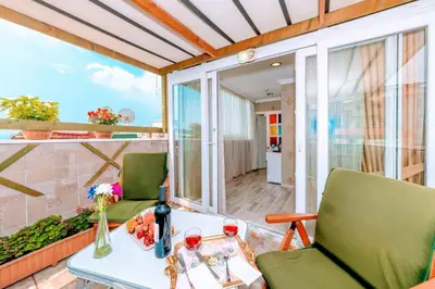 a room with a table and chairs on a balcony at Walnut Shell Hotel in Istanbul