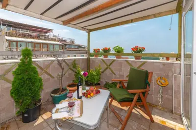 a balcony with a table and chairs on a roof at Walnut Shell Hotel in Istanbul
