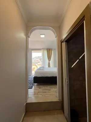 a bedroom with a bed and a window at Taksim Dolunay Suites in Istanbul