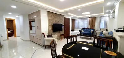 a living room with a couch and a tv in a room at Taksim Flat in Istanbul