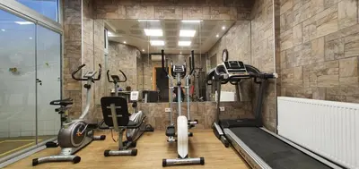 a gym with a bunch of exercise equipment in a room at Taksim Flat in Istanbul