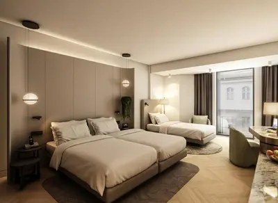 a hotel room with two beds and a table at Rayelin Hotel Taksim in Istanbul