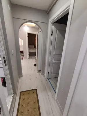 a hallway of a house with a door and a rug at BlueRoyal Home Sultanahmet in Istanbul
