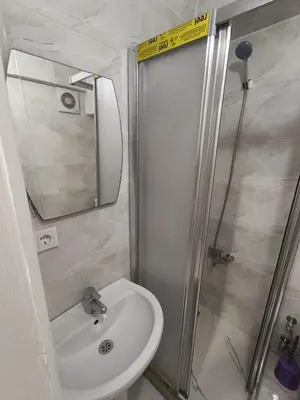 a small bathroom with a sink and a shower at BlueRoyal Home Sultanahmet in Istanbul