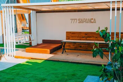 a pergola with a bench on a patio at 777Sapanca Bungalov Konaklama in Sapanca