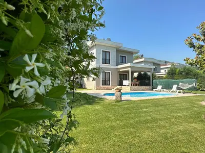 a house with a yard with a swimming pool at Guzel Evler Family Resort in Sapanca