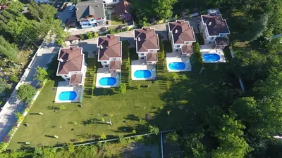 an aerial view of a house with swimming pools at Guzel Evler Family Resort in Sapanca