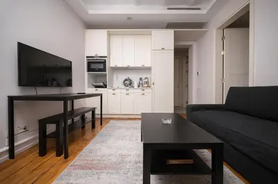 a living room with a couch and a table at Galata Maison by Guest Teori in Istanbul