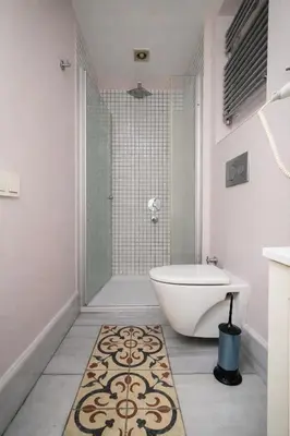 a bathroom with a tub and a toilet and a sink at Galata Maison by Guest Teori in Istanbul