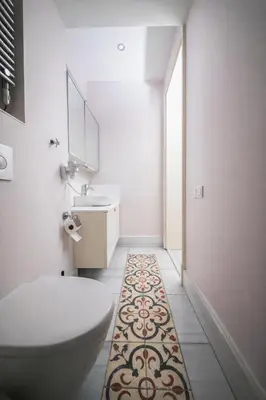 a bathroom with a toilet and a sink and a mirror at Galata Maison by Guest Teori in Istanbul