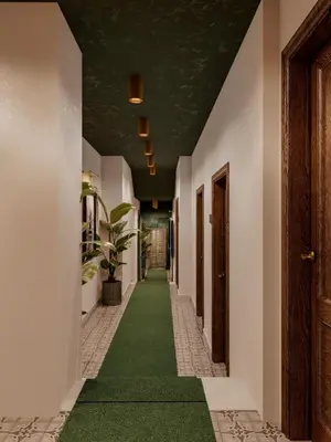 a corridor with a green carpet in a hallway at Castellion Hotels Galata in Istanbul