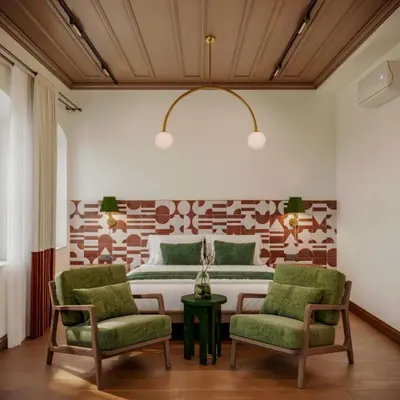 a bedroom with a bed and two chairs at Castellion Hotels Galata in Istanbul