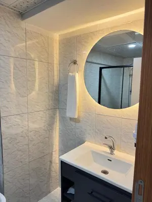 a bathroom with a sink and a mirror at ergene park hotel
