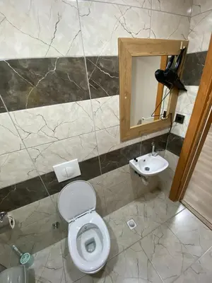 a bathroom with a toilet and a sink at Luxury Suit
