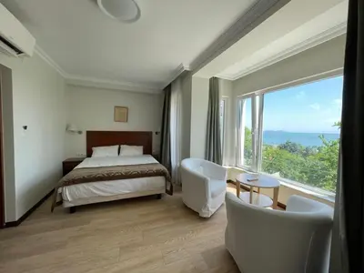 a hotel room with a bed and a large window at Marmara Konak Old City in Istanbul