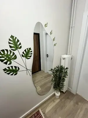 a bathroom with a mirror on the wall at Modern Apartment in the Heart of Kadıköy in Istanbul