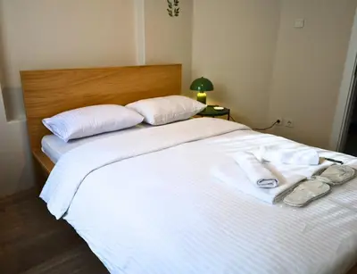 a bedroom with two beds with towels on them at Modern Apartment in the Heart of Kadıköy in Istanbul