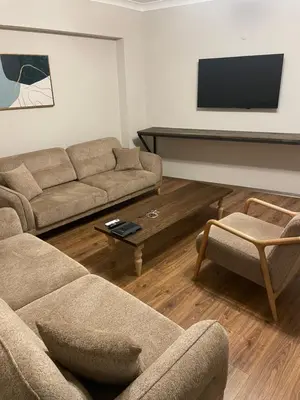 a living room with two couches and a flat screen tv at Pera Line Yalova in Yalova