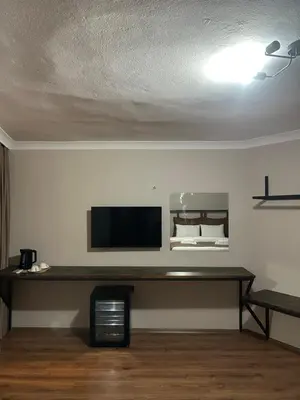 a living room with a flat screen tv on a wall at Pera Line Yalova in Yalova