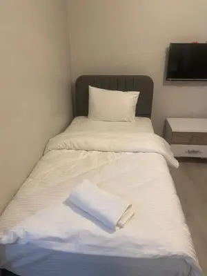 a bed with a white towel on top of it at historic stay istanbul in Istanbul