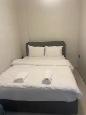 a bed with two white towels on top of it at historic stay istanbul in Istanbul