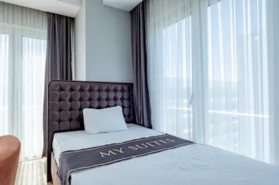a hotel room with a bed and a window at My SUİTES in Istanbul