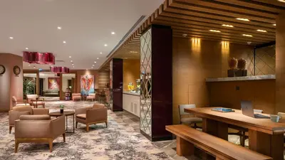 a lobby of a hotel with a desk and chairs at Crowne Plaza Florya Istanbul by IHG in Istanbul