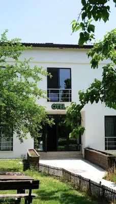 a white building with a sign that reads gut at The Life Nest Hotel in Saray