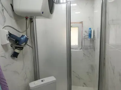 a shower stall in a bathroom with a toilet at La Casa25 in Istanbul